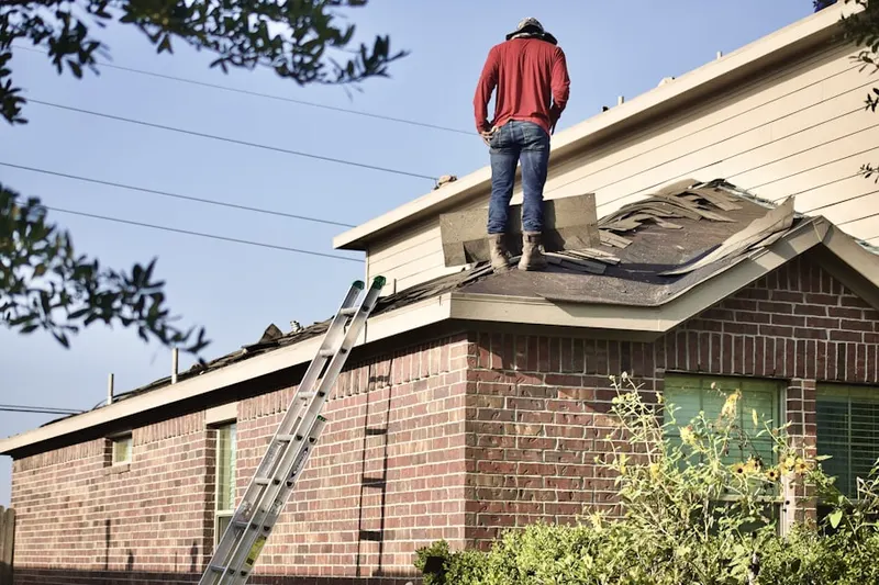 Professional roofer working on a residential roof in Austin